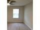 Cozy bedroom with neutral carpeting and a bright window, creating a serene atmosphere at 1150 Collier Nw Rd # H6, Atlanta, GA 30318