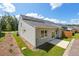 Rear exterior view of home with patio and green lawn at 376 Lakeside Ct, Canton, GA 30114