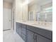 Stylish bathroom with double vanity and marble tile shower at 376 Lakeside Ct, Canton, GA 30114