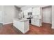 Modern kitchen featuring an island, granite countertops, stainless steel appliances, and hardwood floors at 376 Lakeside Ct, Canton, GA 30114