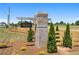 Community entrance to Old Town Estates with brick monument and wooden fence at 170 Ewing Way, Dacula, GA 30019