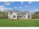 Charming two-story home featuring expansive green lawn and board and batten accents at 170 Ewing Way, Dacula, GA 30019