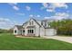 Lovely two-story home with a three car garage and expansive lawn at 170 Ewing Way, Dacula, GA 30019