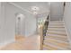 Bright foyer featuring hardwood floors, staircase, and natural light at 170 Ewing Way, Dacula, GA 30019