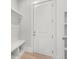 Mud room with storage bench, coat hooks, and shelving at 170 Ewing Way, Dacula, GA 30019