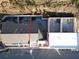 Aerial view of the property with a courtyard, patio, and outlined property lines at 10871 Serenbe Ln, Chattahoochee Hills, GA 30268