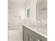 Bathroom featuring a tub/shower combo with gray vanity and white countertop at 10871 Serenbe Ln, Chattahoochee Hills, GA 30268