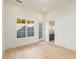 Bright bedroom with natural light, hardwood floors and a glimpse of an en-suite bathroom at 10871 Serenbe Ln, Chattahoochee Hills, GA 30268