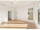 Bedroom featuring hardwood floors, white walls, recessed lighting, and large windows at 10871 Serenbe Ln, Chattahoochee Hills, GA 30268