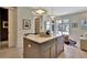 Stylish kitchen island with light countertop and pendant lighting at 10871 Serenbe Ln, Chattahoochee Hills, GA 30268
