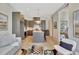 Bright and spacious living room seamlessly connecting to the well-equipped kitchen at 10871 Serenbe Ln, Chattahoochee Hills, GA 30268