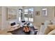 Inviting living room featuring a modern layout and large windows at 10871 Serenbe Ln, Chattahoochee Hills, GA 30268
