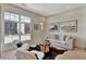 Cozy living room with ample natural light at 10871 Serenbe Ln, Chattahoochee Hills, GA 30268
