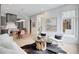 Bright and airy living space with an open floor plan, showcasing the kitchen, dining, and living room areas at 10871 Serenbe Ln, Chattahoochee Hills, GA 30268