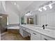 Modern bathroom boasts dual sinks, separate shower, and jacuzzi tub, with natural light at 165 Zelkova Dr, Fayetteville, GA 30215