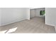 The carpeted bedroom offers a blank canvas for personalization with a bright window overlooking the yard at 165 Zelkova Dr, Fayetteville, GA 30215