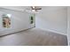 Bright and airy bedroom featuring neutral carpet, white walls and two large windows at 165 Zelkova Dr, Fayetteville, GA 30215
