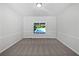 Clean bedroom space with view to pool, carpeted floors, and a minimalist aesthetic at 165 Zelkova Dr, Fayetteville, GA 30215