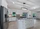 Spacious open kitchen with a large island, stainless steel appliances, and ample cabinet space at 165 Zelkova Dr, Fayetteville, GA 30215
