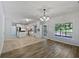 Modern kitchen featuring white cabinets, stainless steel appliances, and a tile backsplash at 165 Zelkova Dr, Fayetteville, GA 30215