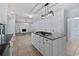 Modern kitchen with a central island, granite countertops, and an open floor plan at 165 Zelkova Dr, Fayetteville, GA 30215
