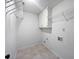 Functional laundry room with shelving and storage for efficient organization at 165 Zelkova Dr, Fayetteville, GA 30215