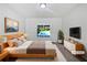 Relaxing bedroom offers serene views of the pool, with contemporary furnishings and natural light at 165 Zelkova Dr, Fayetteville, GA 30215