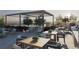 Outdoor dining on a rooftop terrace featuring a pool, trees, built-in grill, and lounge area at 318 Sandy Springs Cir # 110, Atlanta, GA 30328