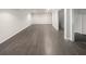Finished basement features neutral colored tile flooring and freshly painted walls at 819 Bermuda Run, Woodstock, GA 30189