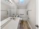 Bathroom featuring a vanity, tile floors, and skylight at 819 Bermuda Run, Woodstock, GA 30189