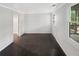 Bedroom with tiled floors, leading to a covered outdoor area at 819 Bermuda Run, Woodstock, GA 30189