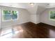 Bright bedroom featuring hardwood floors and natural light at 819 Bermuda Run, Woodstock, GA 30189