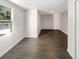 This bedroom features neutral paint, large windows, and modern tile floors at 819 Bermuda Run, Woodstock, GA 30189
