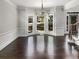 Spacious dining room with large bay window and elegant chandelier at 819 Bermuda Run, Woodstock, GA 30189