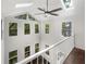 Foyer boasts soaring windows, skylights, and a modern ceiling fan at 819 Bermuda Run, Woodstock, GA 30189