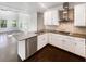 The kitchen boasts stainless steel appliances and sleek countertops at 819 Bermuda Run, Woodstock, GA 30189