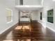 This living room boasts hardwood floors, a modern open layout and high ceilings at 819 Bermuda Run, Woodstock, GA 30189