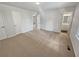 Large bedroom with neutral carpet and doorway to bathroom at 125 Enterprise Dr, Temple, GA 30179