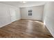 Bright bedroom featuring hardwood floors and a window for natural light at 125 Enterprise Dr, Temple, GA 30179