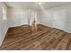 Spacious bedroom with hardwood flooring, closet, and doorway to another room at 125 Enterprise Dr, Temple, GA 30179