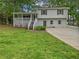Charming home with a cozy front porch, offering a welcoming entrance and curb appeal at 125 Enterprise Dr, Temple, GA 30179
