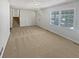 Spacious living room featuring new carpeting and ample natural light at 125 Enterprise Dr, Temple, GA 30179