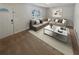 Living room with a neutral color palette, large sectional sofa, and an abundance of natural light at 125 Enterprise Dr, Temple, GA 30179