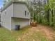 The backyard features a small deck and a wooded area at 5723 Antelope Trl, Atlanta, GA 30349