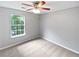 Well-lit bedroom featuring neutral walls, carpet flooring, and a ceiling fan for comfort at 5723 Antelope Trl, Atlanta, GA 30349