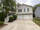 Traditional two-story home featuring a two-car garage and inviting front entrance at 5723 Antelope Trl, Atlanta, GA 30349