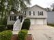 Charming two-story home with a well-maintained front yard and two-car garage at 5723 Antelope Trl, Atlanta, GA 30349