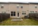 Backyard featuring a small patio and a privacy fence at 3513 Lakeview Crk, Lithonia, GA 30038