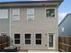 Backyard featuring the exterior of a townhouse with an AC unit and a wooden fence at 3513 Lakeview Crk, Lithonia, GA 30038