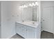 Bathroom featuring double sinks with drawers and a large mirror at 3513 Lakeview Crk, Lithonia, GA 30038